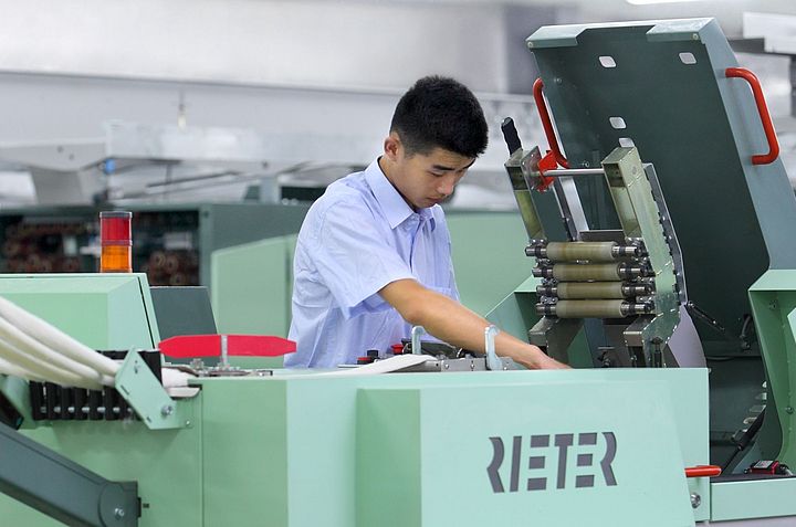 Rieter field service expert is working on the draw frame machine