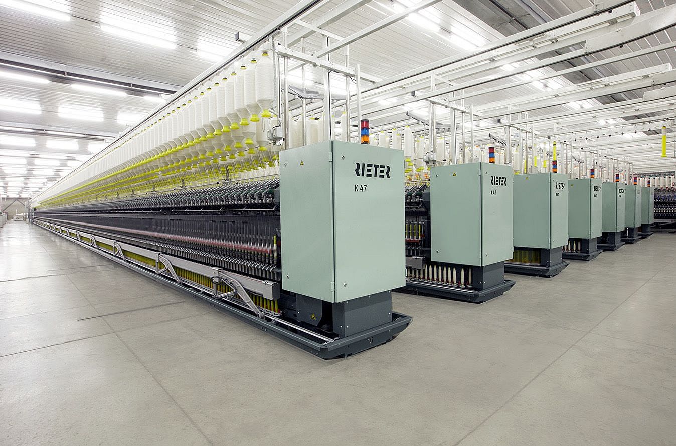 Compact-spinning machine K 47 – fully compacted yarns produced with high flexibility. Compact-spinning machine K 47 – spinning room with several K 47 machines