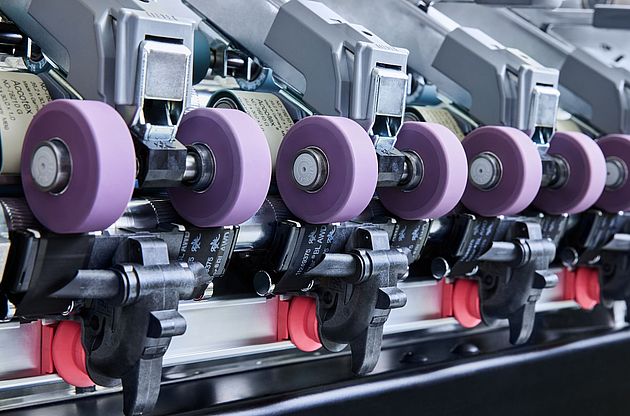 COMPACTapron installed on a Rieter ring spinning machine.