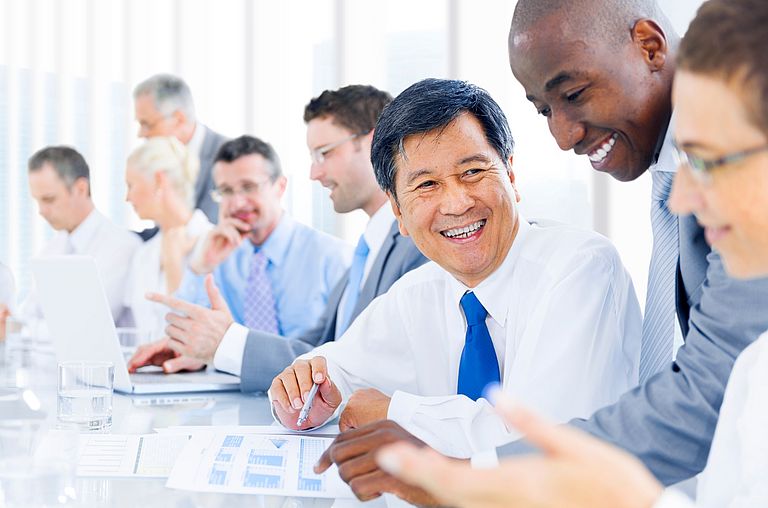 Laughing men in a meeting