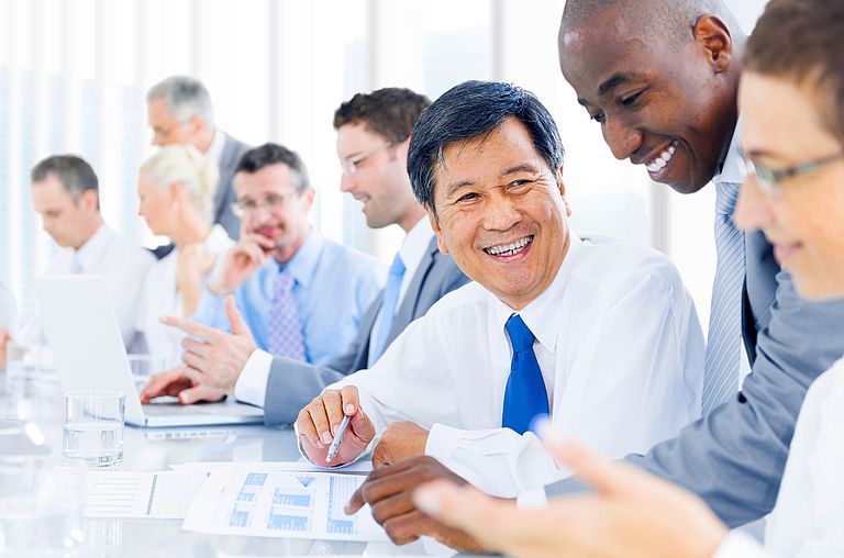 Laughing men in a meeting