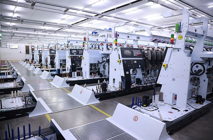 Underfloor link between Rieter Autoconer X6 and the ring spinning machines