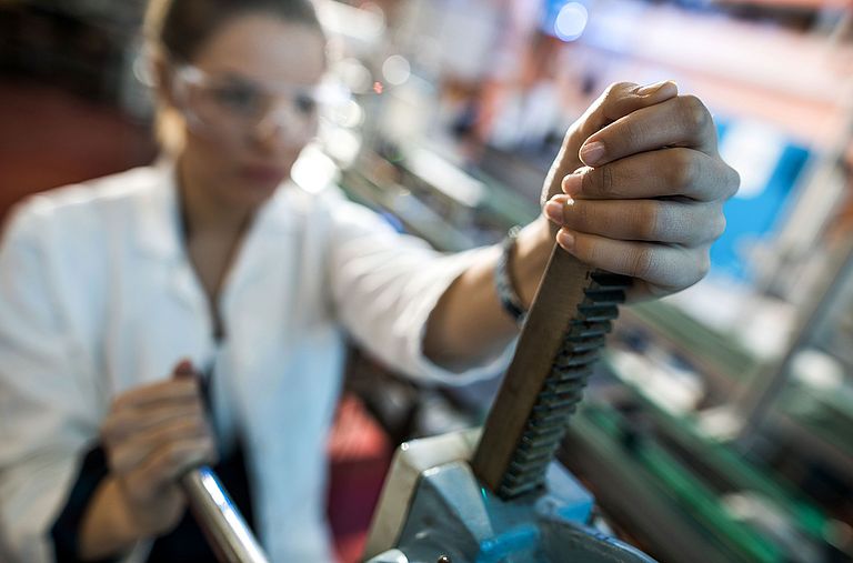 Apprentice working on a machine