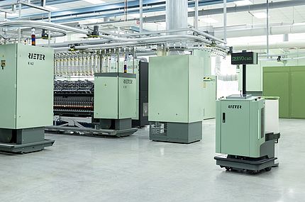 Towards the Small Spinning Mill: Automatic can transport SERVOcan from Rieter at work in a spinning mill.