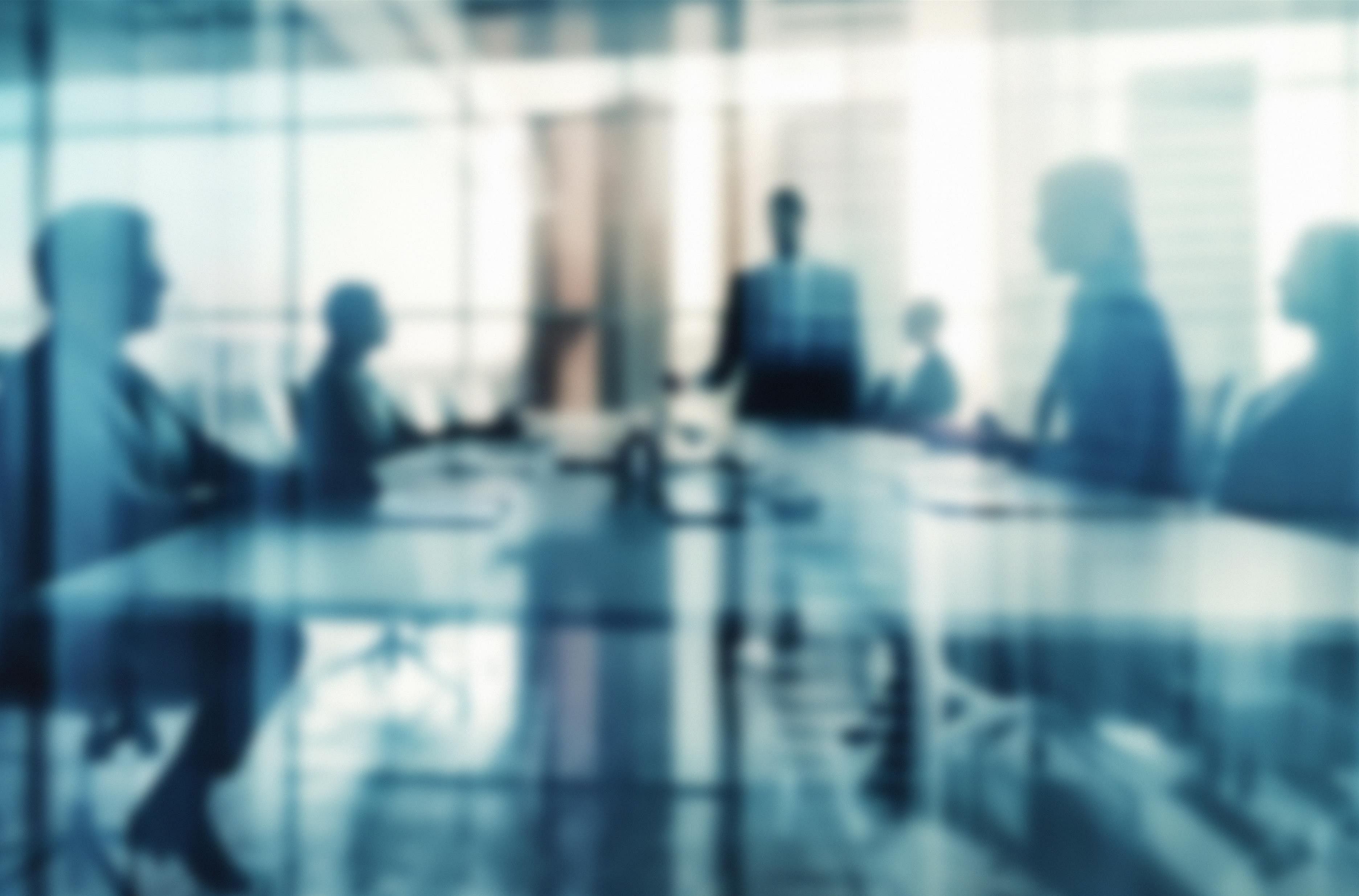 Group of managers in a meeting room (symbol)