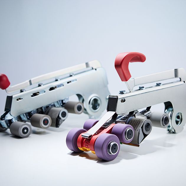 Suessen top weighting arms