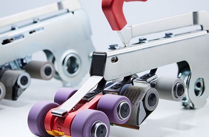 Suessen top weighting arms