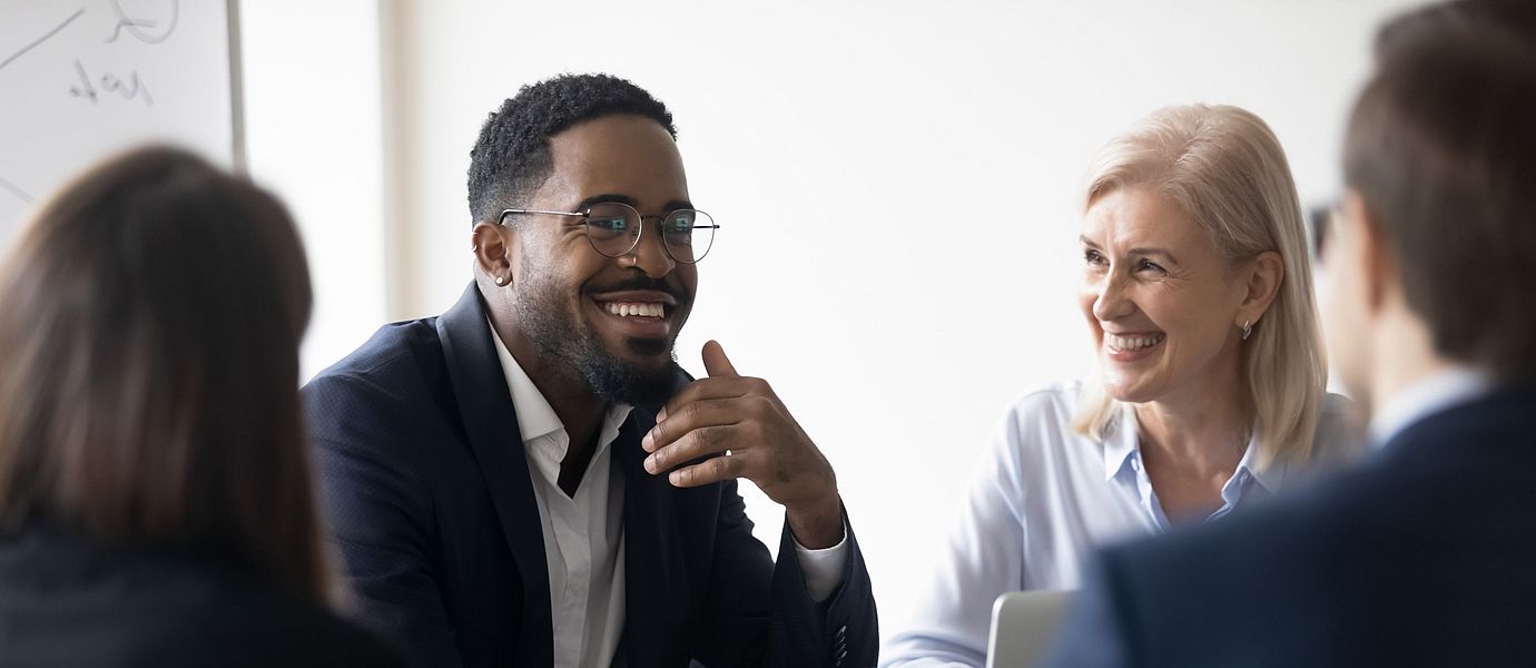 Discussion among business people in a meeting room.