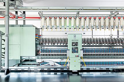 Automated piecing for ring and compact-spinning machines with the fully automatic piecing robot ROBOspin.
