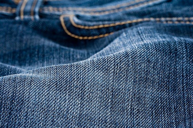 Close-up of fabric of denim pants