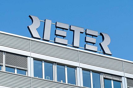 Rieter Logo Against Blue Sky