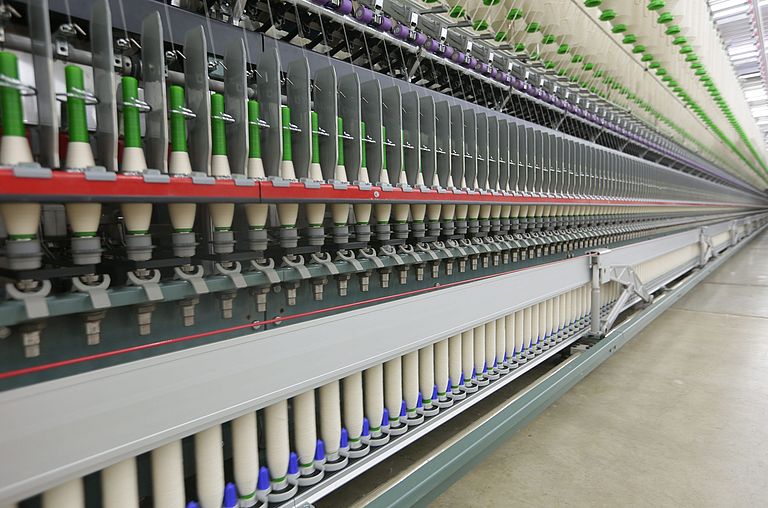 Ring spinning machine in a spinning mill